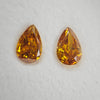 Yellowish orange diamonds, 0.48 & 0.44 carats, pear shape