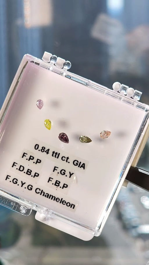 Multi colored natural diamonds, GIA certified, 0.84 total carats, pear shapes