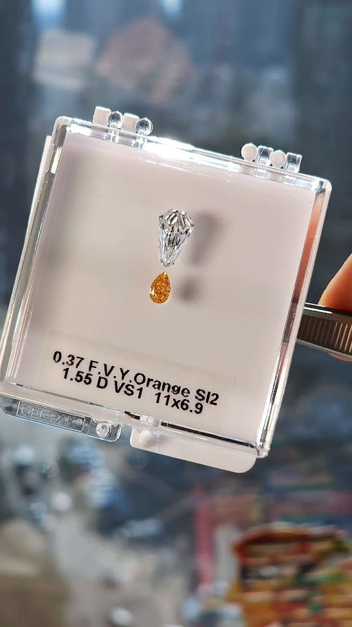 Collection of colorless & orange diamonds, 1.92ct., GIA certified, SI2 clarity