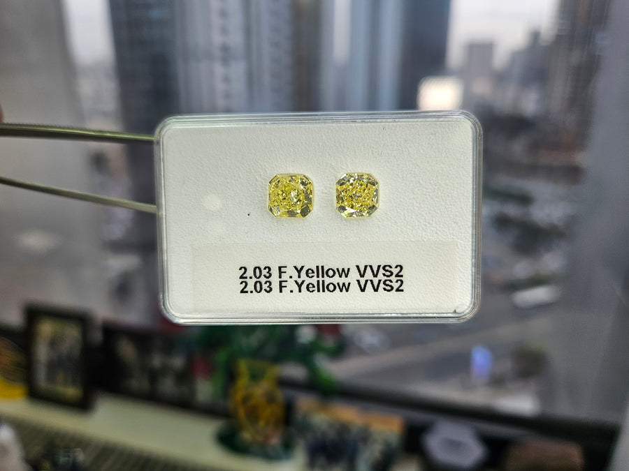 Yellow diamonds, 2.03 & 2.03 carats, radiant shape, both VVS2 clarity