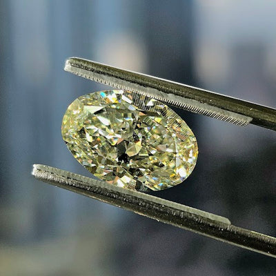 this is an oval shaped natural color diamond certified by GIA