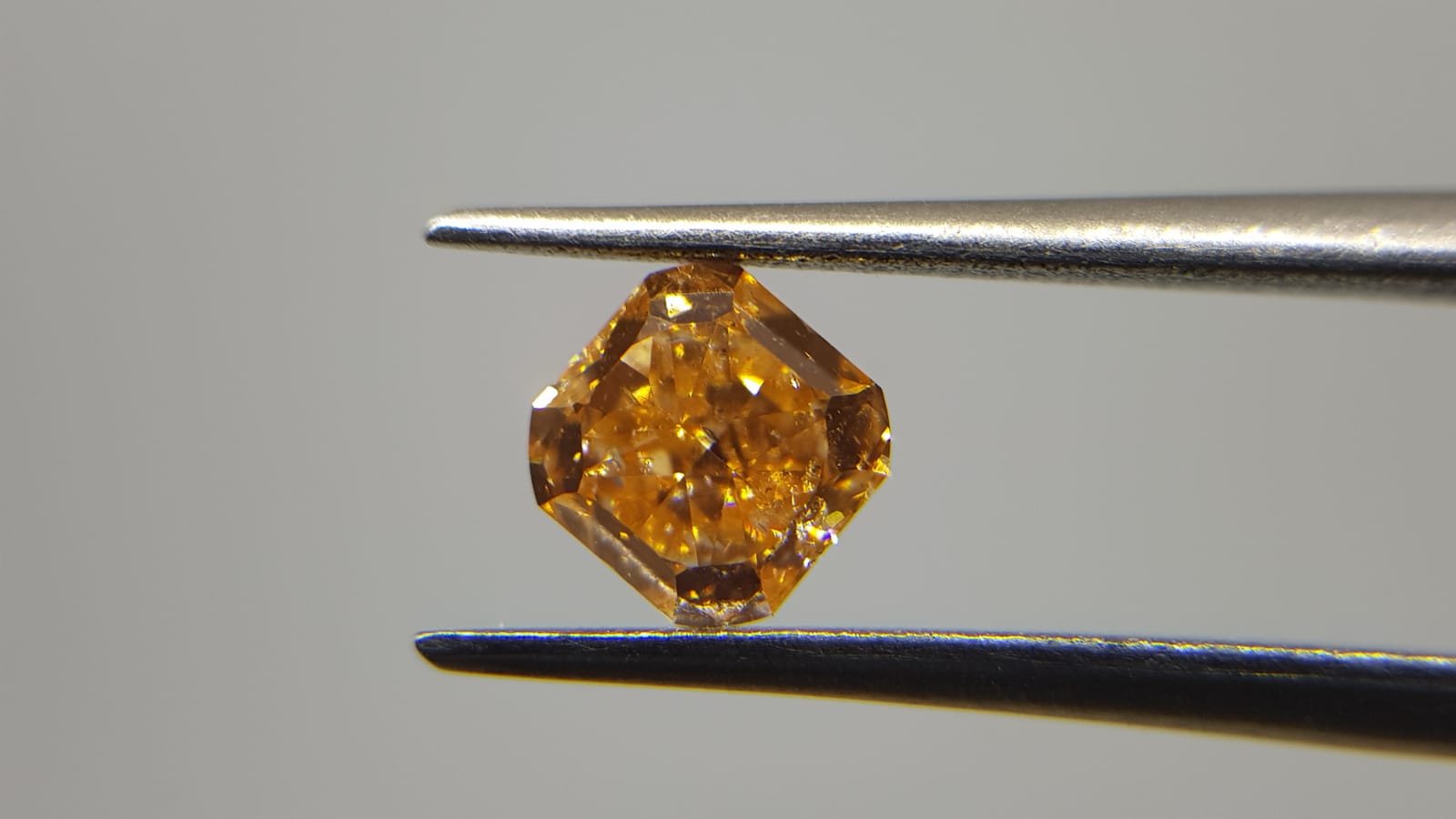 0.63 Carat RADIANT Shape ORANGE Color Diamond