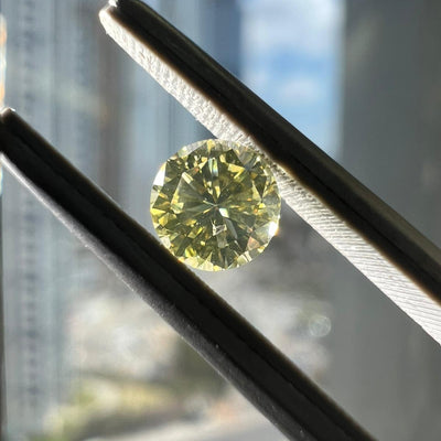 Light yellow diamond, 0.41 carat, round shape, SI2 clarity