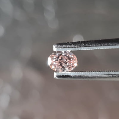 0.71 Carat OVAL Shape ORANGEY PINK Color Diamond