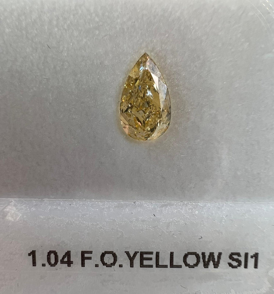 1.04 Carat PEAR Shape ORANGY YELLOW Color Diamond