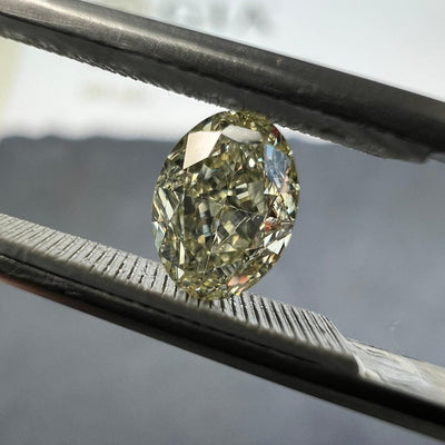 Light yellow diamond, 0.76 carat, oval shape, VS2 clarity