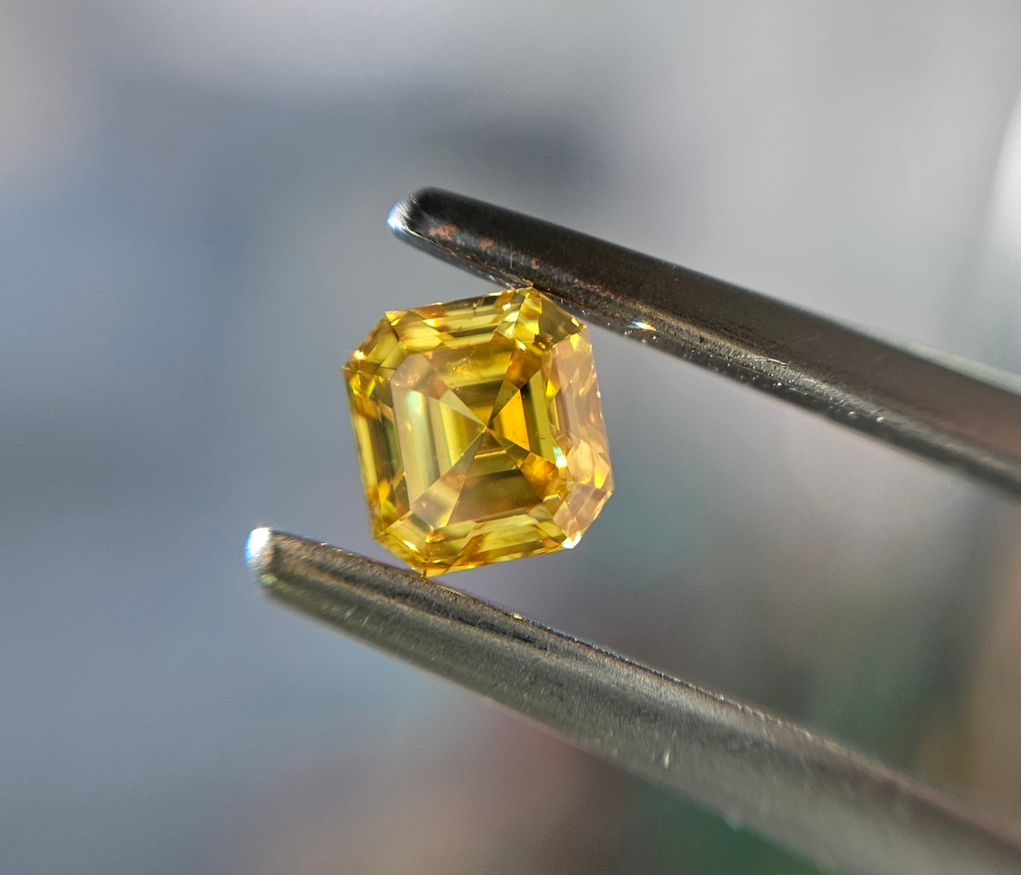 Yellow diamond, 0.47 carat, emerald shape, SI2 clarity