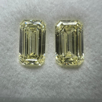 Light yellow diamonds, 1.27 & 1.26 carats, matching emerald shapes, VS1 & VVS2 clarity