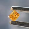 loose natural orange diamond in tweezer