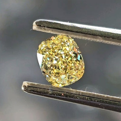 natural colored diamond yellow cushion shape over 1 carat