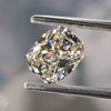 cushion shaped natural diamond, touch of brown bit of pink haze, big diamond colorless