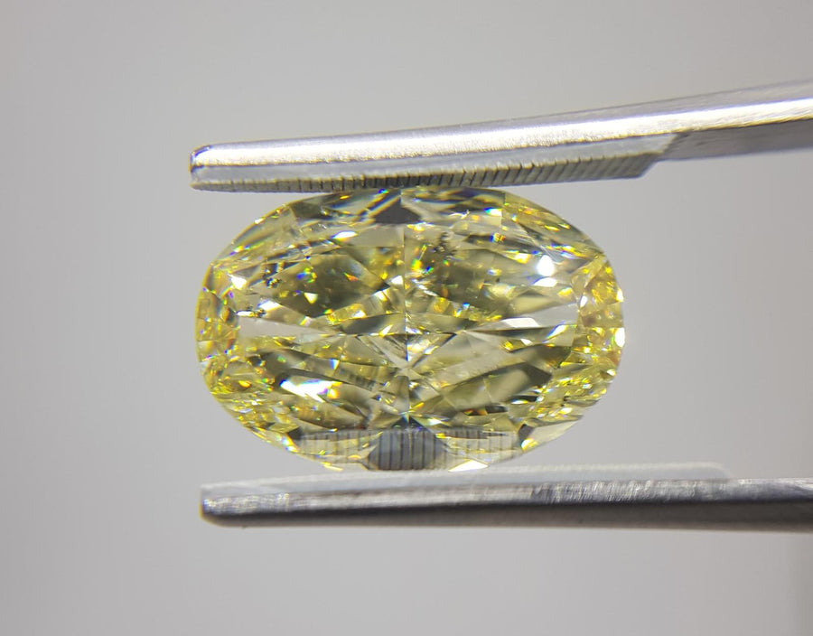 9.10 Carat OVAL Shape YELLOW Color Diamond - VMK Diamonds