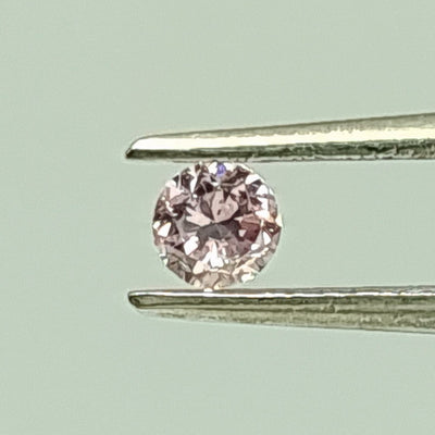 0.15 Carat ROUND Shape Purplish PINK Color Diamond